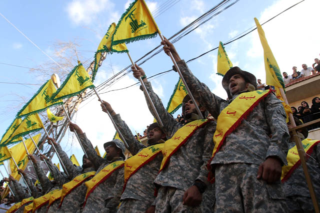 Members of Lebanon's Hizbollah movement stand at attention during the funeral of a fighter, who was killed in conflict against militant groups in the mountainous area around the Lebanese town of Arsal on the eastern border with war-ravaged Syria, in the southern town of Bisariyeh, on Monday (AFP photo)