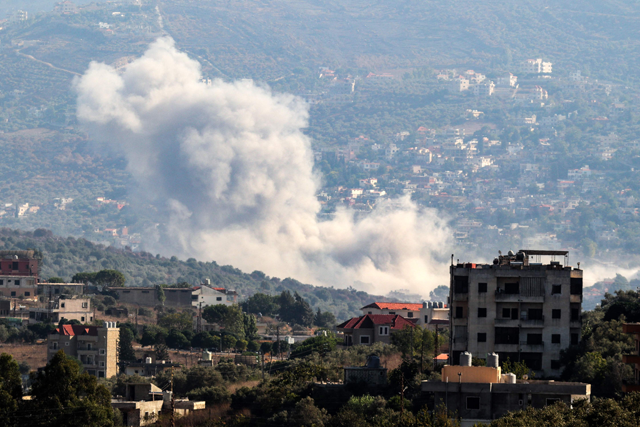 Smoke billows from the site of an Israeli strike that targeted the southern Lebanese village of Kfar Kila on August 21, 2024. The cross-border violence has killed some 590 people in Lebanon, mostly Hizbollah fighters but also including at least 128 civilians, according to AFP's tally (AFP photo)