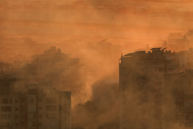 Smoke fumes cover a neighbourhood of Beirut's southern suburbs near Beirut International Airport following an Israeli airstrike on on October 19, 2024 (AFP photo)
