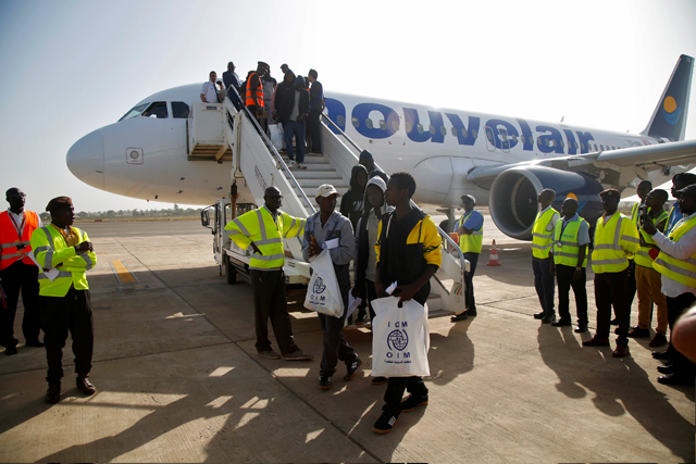 Gambian migrants who voluntarily returned from Libya arrive at the airport in Banjul, Gambia, on April 4 (Reuters photo)
