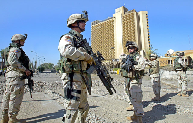 In this file photo taken on October 25, 2005, US soldiers secure the area in front of the Palestine Hotel in Baghdad a day after three suicide car bombs attack hit the compound (AFP photo)