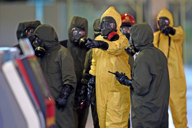 Members of Malaysia’s hazmat team conduct a decontamination operation at the departures terminal of the Kuala Lumpur International Airport 2 in Sepang on Sunday (AFP photo)