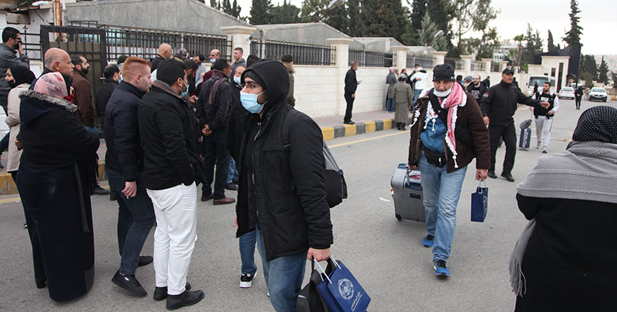Jordanian nationals who fled the war in Ukraine arrive at Marka military airport in Amman upon their evacuation by a military plane from Bucharest and Budapest on Thursday (Petra photo)