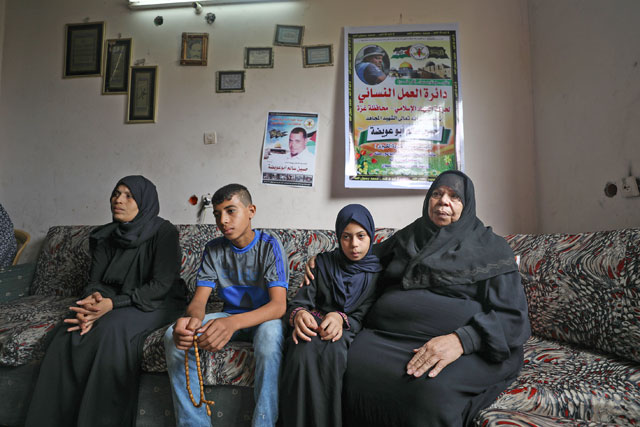 Sevsen Abu Avida (left), who lost her husband Hossein Abu Avida at the hands of Israeli occupation soldiers during the Great March of Return demonstrations near the Israel-Gaza border fence, and Hossein Abu Avida's older sister Halime (right) are seen during an interview in Gaza City, Gaza, on Monday (Anadolu Agency photo)