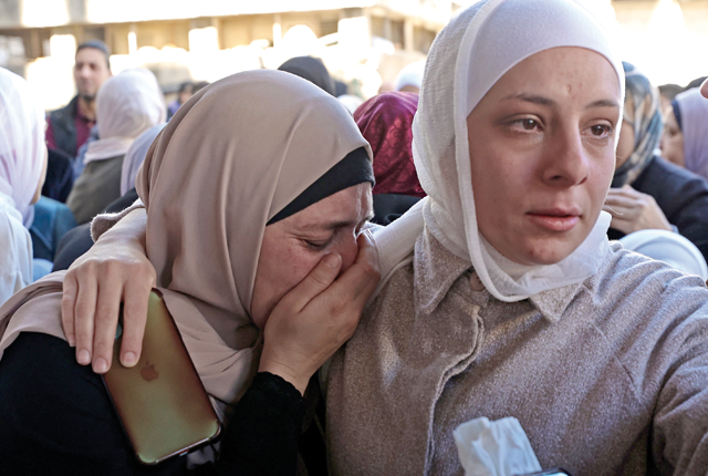 Relatives mourn during the funeral of Palestinian Mohammed Abu Bakr, who was killed by Israeli troops during a raid in Nablus in the occupied West Bank, on Monday (AFP photo)