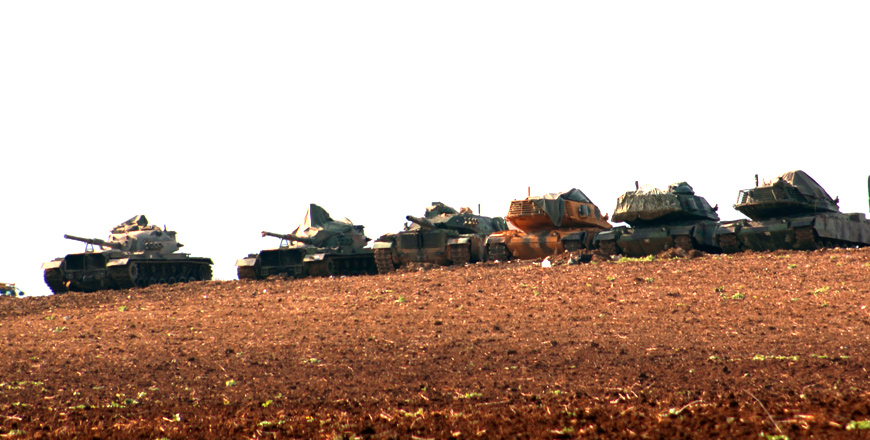 This photo taken from Turkey's Hatay province shows Turkish army forces' artillery units hit targets within the 'Operation Olive Branch' launched in Syria's Afrin on Thursday (Anadolu Agency photo)