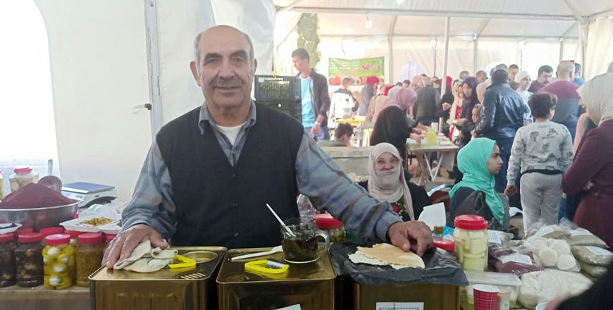 Farmer showcases his olive oil at the 19th National Olive Festival, which concluded on Saturday  (Photo courtesy of  NCARE)
