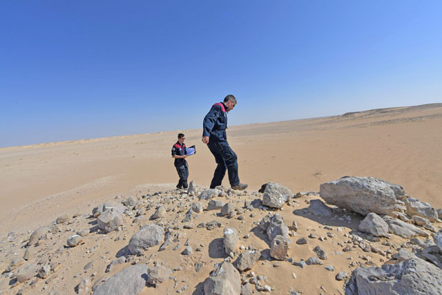 Members of the Austrian Space Forum inspect a site in Oman's Dhofar Desert, near the southern Marmul outpost, on Sunday in preparation for a four-week Mars simulation mission due to begin next year (AFP photo)