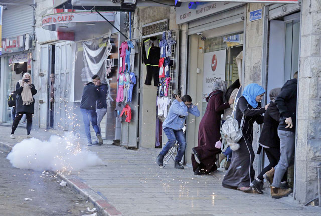 Israeli forces intervene during a protest against US President Donald Trump’s announcement to recognise Jerusalem as the capital of Israel and plans to relocate the US embassy from Tel Aviv to Jerusalem, in Jerusalem's Old City, on Saturday (Anadolu Agency)