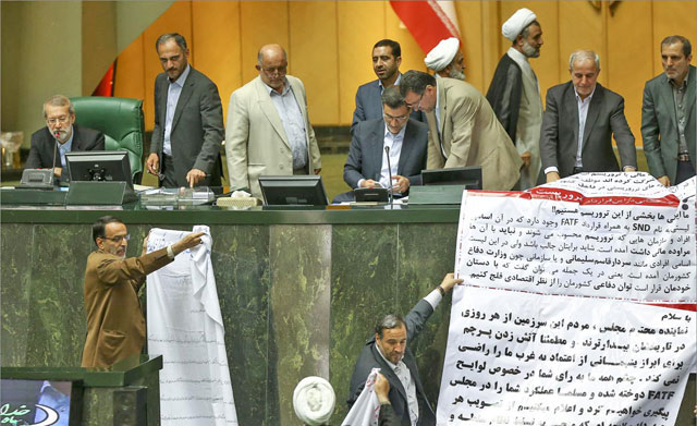 This handout photo provided by the Iranian parliament on Sunday shows Iranian lawmakers gathering during a session discussing joining the UN Terrorism Financing Convention in the capital Tehran (AFP photo)