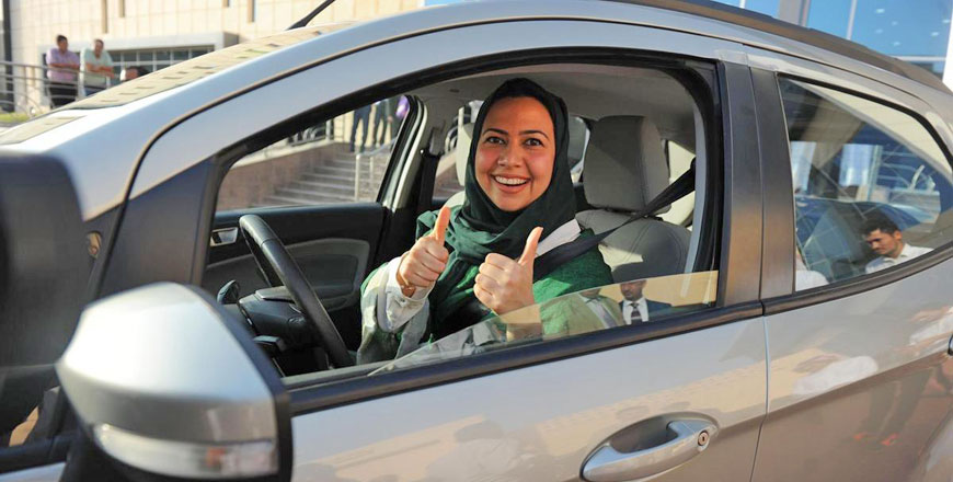 A Saudi woman poses for a photo after having a driving lesson in Jeddah, on March 7 (AFP photo)