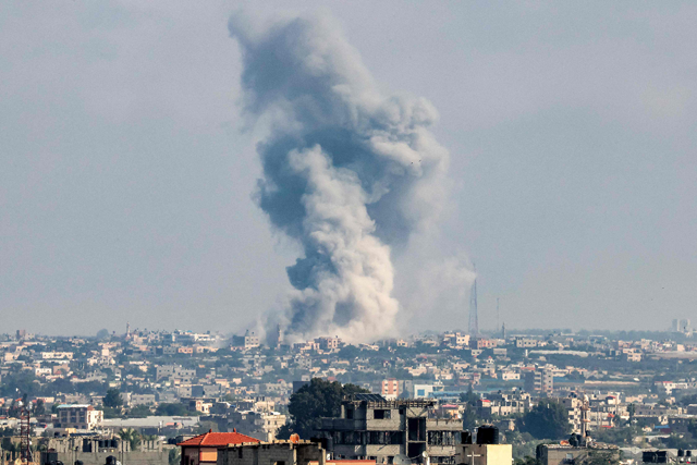 A smoke plume erupts during Israeli bombardment in Rafah in the southern Gaza Strip on Tuesday (AFP photo)