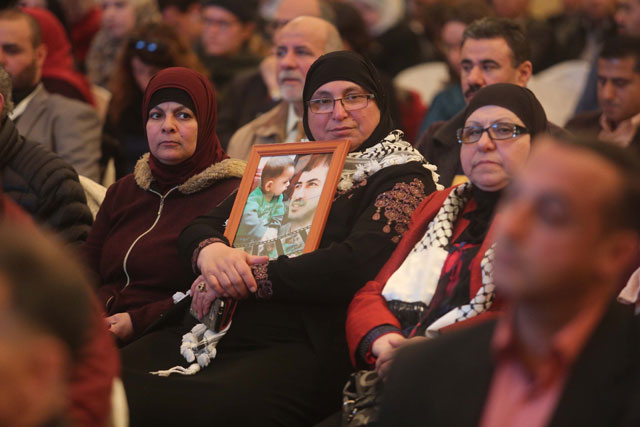 People attend a conference titled ‘Palestinian children and Israel's politics’ held to draw attention to the violations that Palestinians in Israeli prisons face and to ensure the release of the prisoners in Ramallah, occupied West Bank, on Wednesday (Anadolu agency photo)