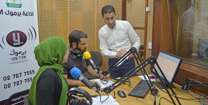 Azzam Al Azzam briefs the radio staff at Yarmouk FM studio in Irbid recently (Photo courtesy of Azzam al Azzam)
