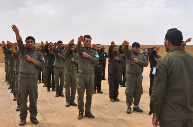 Cadets from the Interior Security Forces of Raqqa, the first police force formed by the international coalition in charge of maintaining order in Syria's northern Raqqa province, take part in a training in the courtyard of a school in Ain Eissa, some 50 kilometres north of Raqqa, on Tuesday (AFP photo)