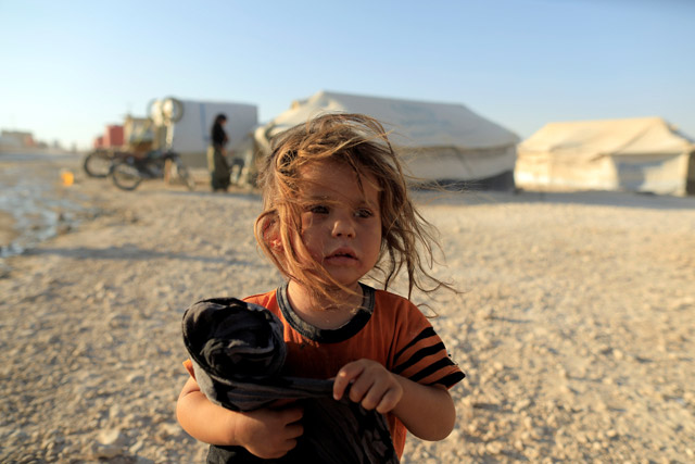 An internally displaced girl who fled Raqqa is pictured at a camp in Ain Issa, north of Raqqa, Syria, on Saturday (Reuters photo)