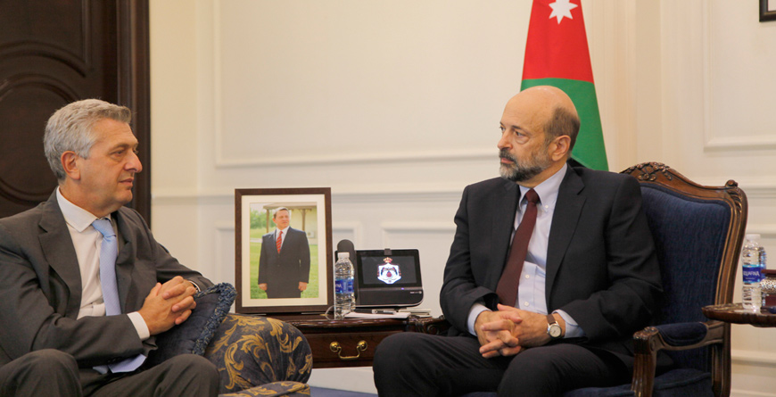 Prime Minister Omar Razzaz meets with UN High Commissioner for Refugees Filippo Grandi in Amman on Tuesday  (Petra photo)  