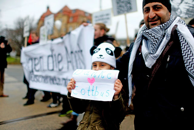 A child holds placard during the demonstration against discrimination of migrants in Cottbus, Germany, on Saturday. Sign reads ‘Thank you Cottbus’ (Reuters photo)