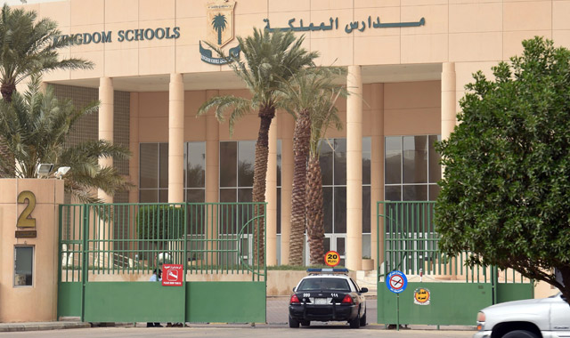 A picture taken on Wednesday shows a police car entering through the main entrance of the Kingdom School in Riyadh (AFP photo)