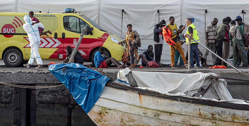 Spanish Red Cross members hold children after a 'cayuco' boat with 57 migrants onboard arrived at La Restinga port on the Canary island of El Hierro, on September 14, 2024 (AFP photo)