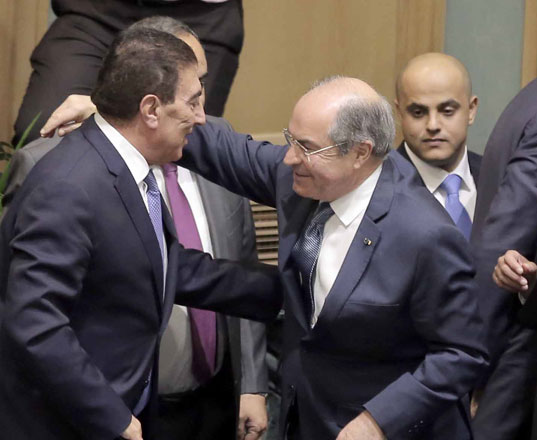 Prime Minister Hani Mulki congratulates Lower House Speaker Atef Tarawneh for his election at the outset of the new parliamentary session on Monday (Photo by Hassan Tammi)