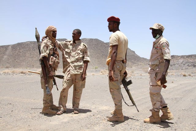 In this file photo taken on April 12, 2017, Sudanese soldiers patrol outside the west of the Yemeni coastal port town of Mokha (AFP photo)