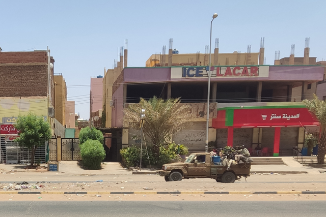 A vehicle of the paramilitary Rapid Support Forces drives down Al Sittin (sixty) road in Khartoum on Monday as fighting persists between two rival generals (AFP photo)