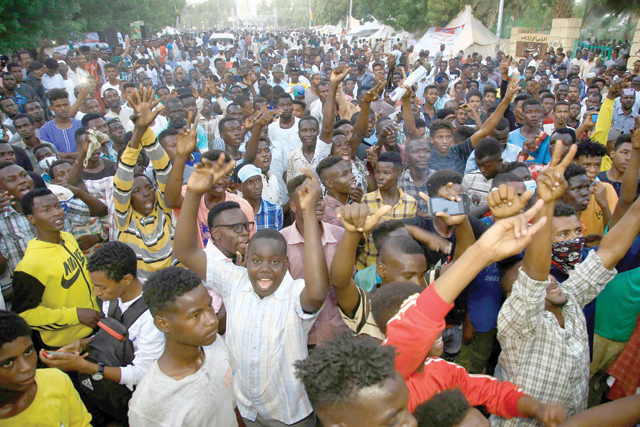 Sudanese protesters take to the streets in the capital Khartoum durning a demonstration demanding the dissolution of the transitional government on Monday (AFP photo)