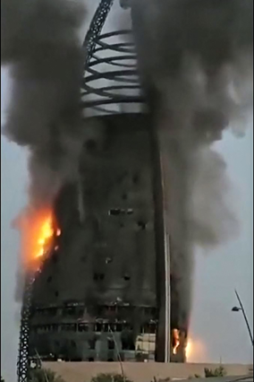A grab from a UGC video posted on the X platform (formerly Twitter) on Sunday, reportedly shows a raging fire inside the Greater Nile Petroleum Oil Company Tower in Khartoum (AFP photo)