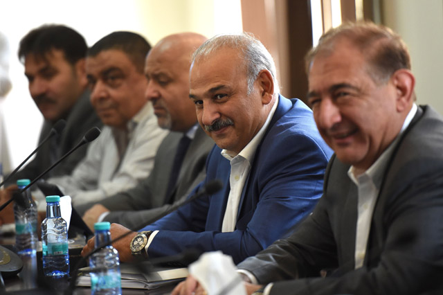 Syrian actor and member of the Syrian opposition Jamal Suleiman (second right) and former Syrian deputy prime minister Qadri Jamil (right), member of Syria's regime-tolerated opposition, are seen during a meeting in Riyadh, on Sunday (AFP photo)