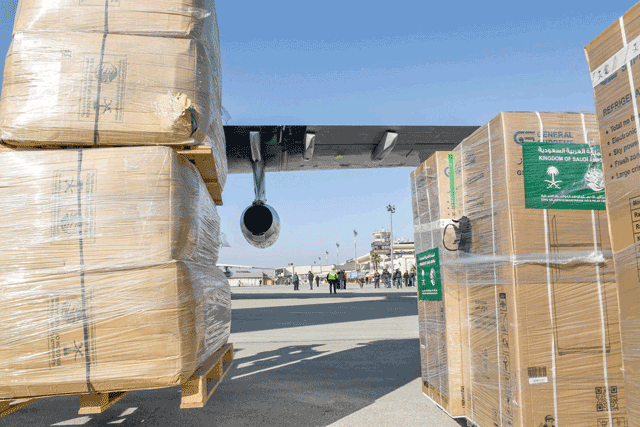 Humanitarian aid relief packages provided by Saudi Arabia for victims of the February 6 earthquake are unloaded off of an Ilyushin Il-76TD transport aircraft at Aleppo International Airport in northern Syria on Tuesday (AFP photo)
