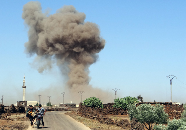 Smoke rises after Syrian forces carried out an attack in Syria’s southwestern Daraa province on Saturday (Anadolu Agency photo)