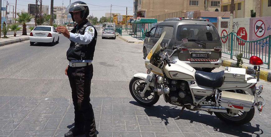 This police officer regulates traffic in Maan, some 220km south of Amman (File photo)