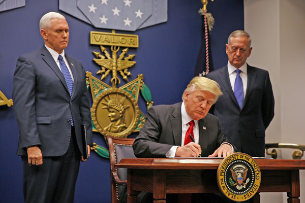 President Donald Trump signs an executive order for a US travel ban, at the Pentagon in Washington, US, January 27 (Reuters photo)
