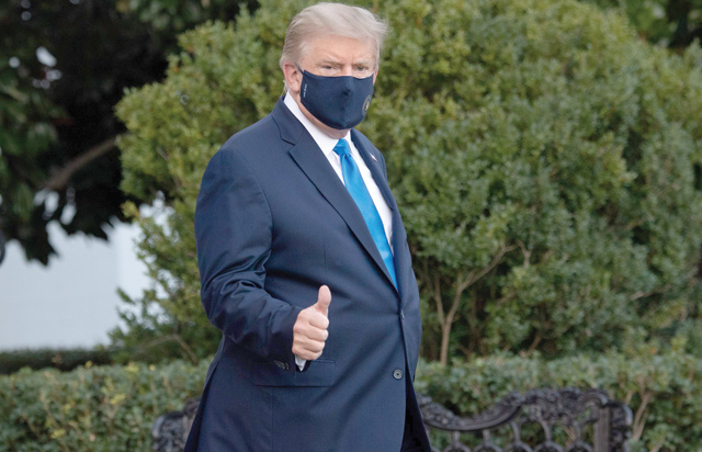 President Donald Trump gives a thumbs up as he walks to Marine One prior to departure from the South Lawn of the White House in Washington, DC, Friday, as he heads to Walter Reed Military Medical Centre, after testing positive for COVID-19 (AFP photo)