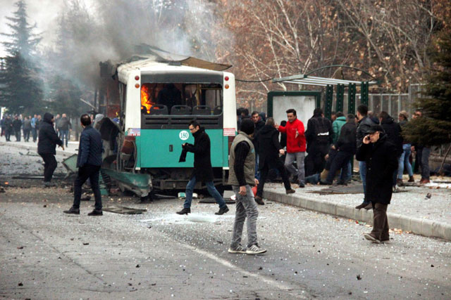 A public bus is burning at the scene of a car bomb attack in central Anatolian city of Kayseri, Turkey, Saturday (AP photo)