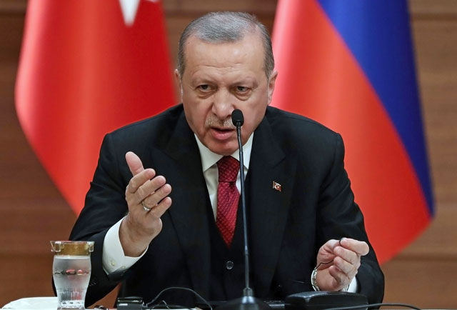 Turkish President Recep Tayyip Erdogan attends a joint press conference with the leaders of Russia and Iran as part of a tripartite summit on Syria, in Ankara, on Wednesday (AFP photo)