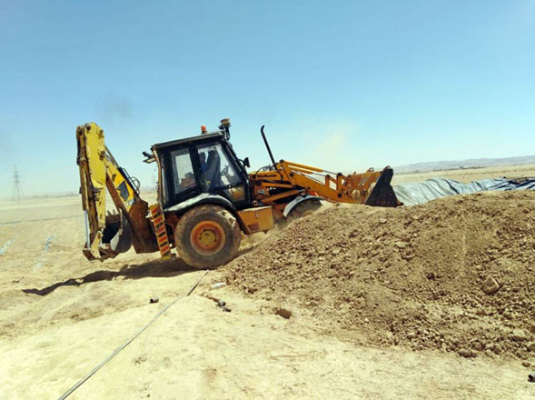 In this undated photo, a tractor fills in an illegal well. The Ministry of Water and Irrigation’s Water Authority announced on Tuesday it had found violations in Muwaqqar and Qatrana (Photo courtesy of Water Ministry)