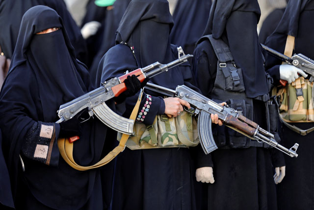 Women hold rifles as they attend a rally to show support to the Houthi movement in Sanaa, Yemen, on Saturday (Reuters photo)