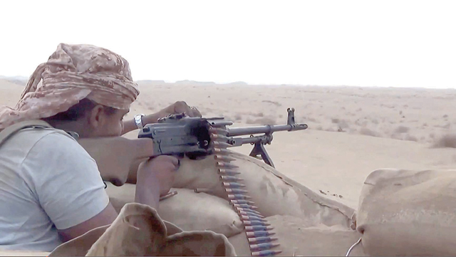 A grab from an AFPTV video shows a pro-government fighter aiming his weapon during fighting on Monday as forces in Yemen backed by a Saudi-led military coalition said they had seized control of the northern oil province of Shabwa from Iran-backed Houthi rebels (AFP photo)