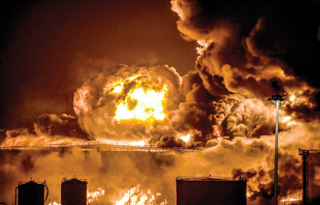 Smoke and flames rise from a Saudi Aramco oil facility in Saudi Arabia's Red Sea coastal city of Jeddah, on Friday, following a reported Yemeni rebels attack (AFP photo)