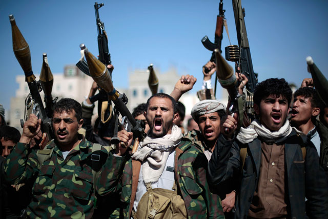 In this November 24 file photo, tribesmen loyal to Houthi rebels hold their weapons as they chant slogans during a gathering to mobilise more fighters into battlefronts in several Yemeni cities in Sanaa, Yemen (AP photo)