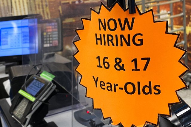 In this file photo taken on May 7, a 'now hiring' sign is posted at a discount department retail store in Las Vegas, Nevada  (AFP photo)