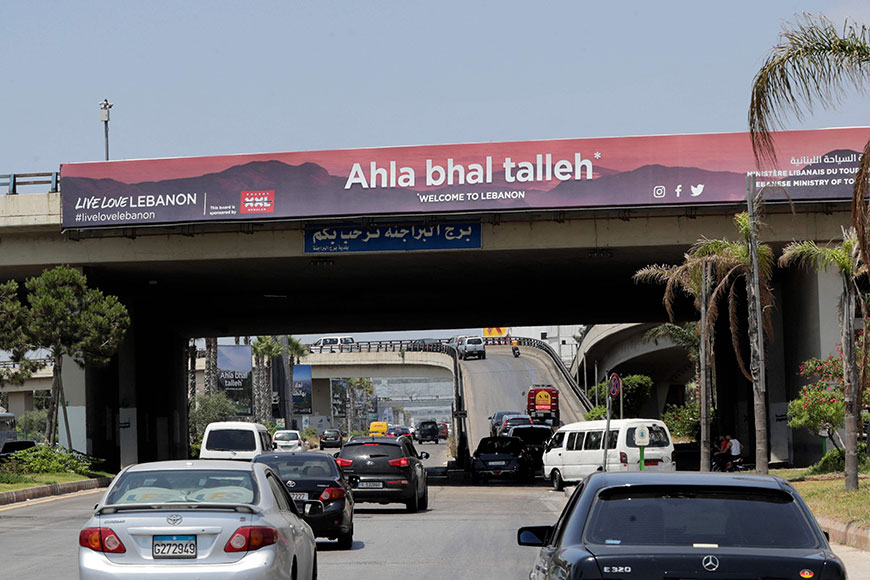 A welcoming billboard is seen along the airport road in Lebanon's capital Beirut on Wednesday following a campaign by the Tourism Ministry to replace the pictures of political figures with images of natural sites as the country is trying to draw more tourists (AFP photo)