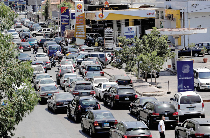 Few days ago, frustrated drivers waited for hours in long car queues outside petrol stations in Lebanon to fill up their tanks as the value of the Lebanese currency continued to drop (AFP photo)