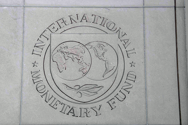 The logo of the International Monetary Fund (IMF) is seen on a wall of its headquarters in Washington, DC, on April 14, 2020. (AFP photo) 