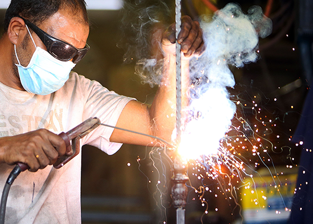 An Arab blacksmith works at a workshop in Kuwait City on Thursday (AFP photo)