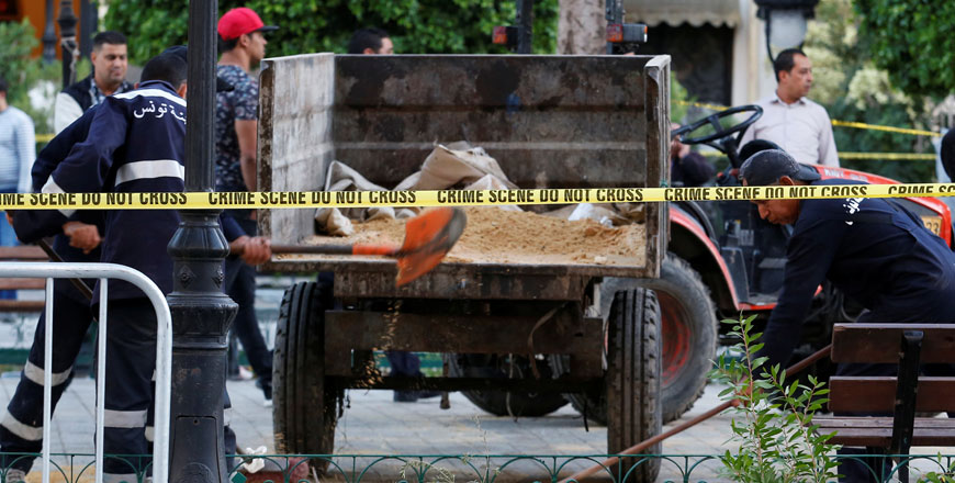 Workers clean the site of an explosion in the centre of the Tunisian capital Tunis, Tunisia, on Monday  (Reuters photo)