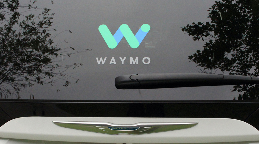 This file photo shows Waymo self-driving cars with the company logo at the Google-owned company's headquarters in Mountain View, California (AFP photo)