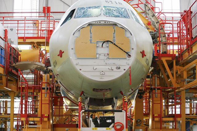 An employee works at the A320 family final assembly line of Airbus factory in Tianjin, China, on August 12, 2015 (Reuters photo)